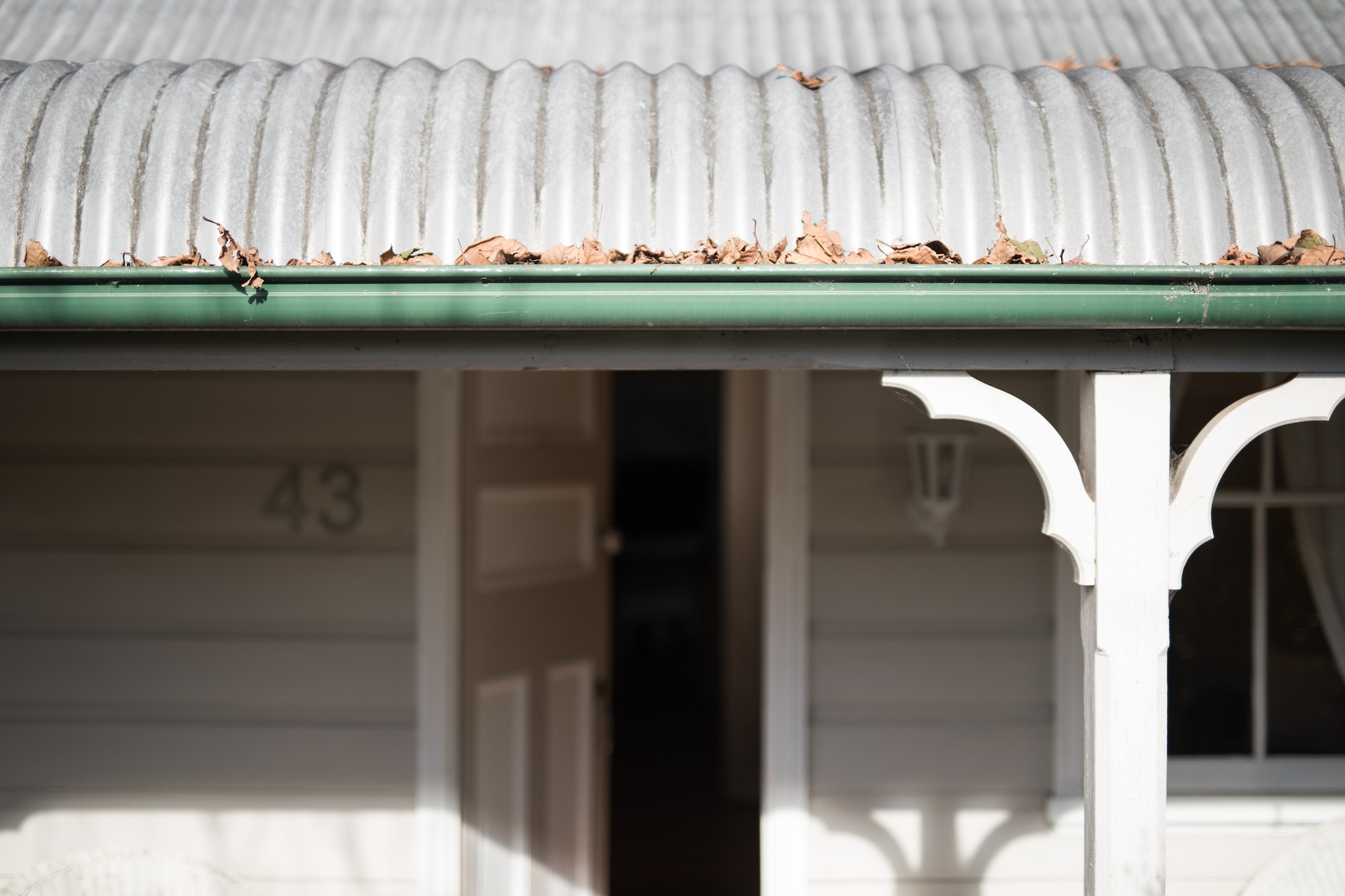 Exterior rustic cottage with gutter