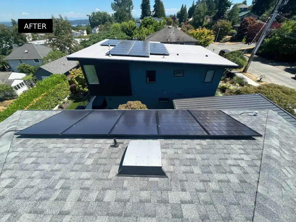 Solar panels on a residential roof gleaming in the sunlight, looking spotless and efficient after solar cleaning service.