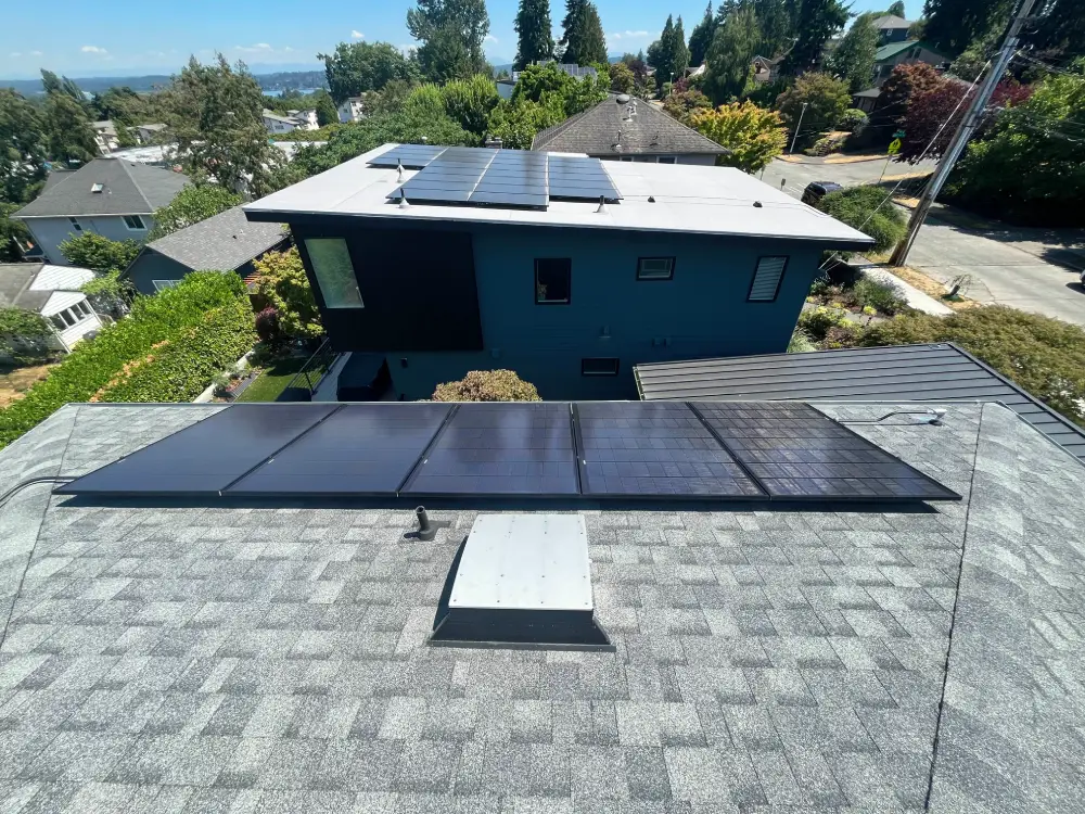 A roof with shiny solar panels reflecting the sky, showing excellent results after solar cleaning for improved energy output.