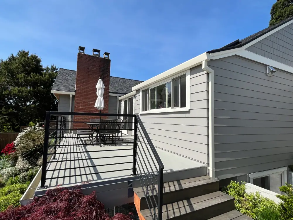 Home exterior with multiple windows shining after a thorough window cleaning for a polished, streak-free finish.