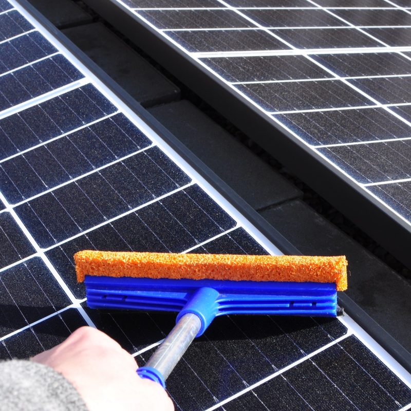 Cleaning solar panels with a wiper Cleaning solar panels with a wiper